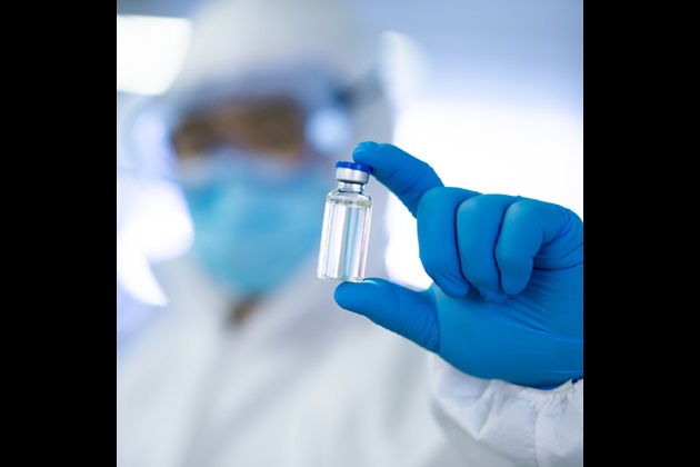 Lab technician with medical vial