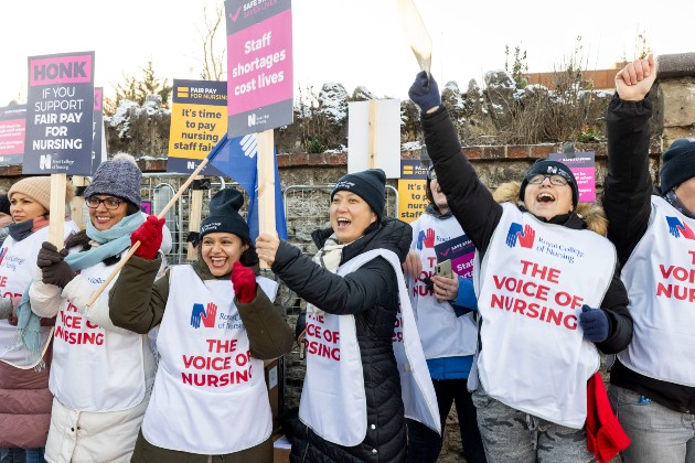 Members shouting and cheering on a busy picket line in Oxford