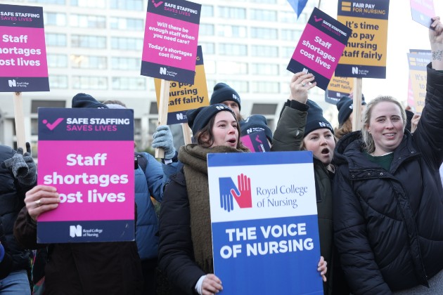 RCN members on the picket line at St Thomas's Hospital with various RCN signs and placards