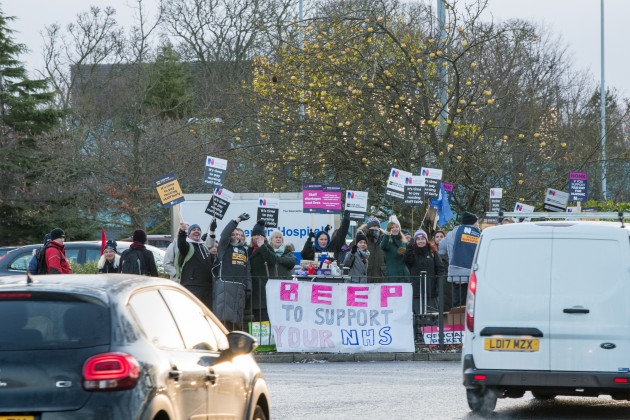 Picket line at Newcastle with cars driving past and beeping their support