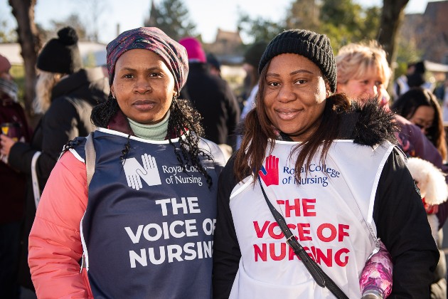 Two members standing united on the picket line in Reading