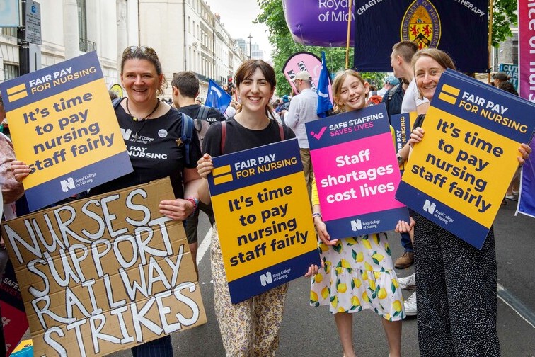 RCN members and supporters march for fair pay in June 2022 alongside other unions