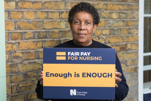 Maive Coley with a Fair Pay for Nursing campaign sign
