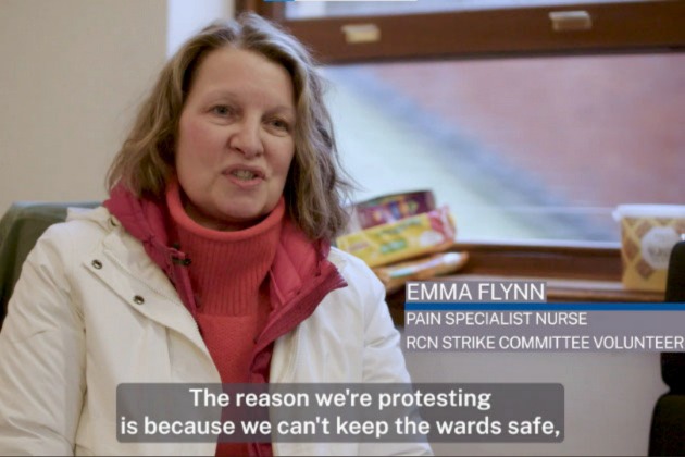 Still from video shows Emma Flynn, picket supervisor, speaking to camera. Caption reads: 'Emma Flynn Pain Specialist Nurse and RCN Strike Committee Volunteer'. Subtitle reads: 'The reason we're protesting is because we can't keep the wards safe'.