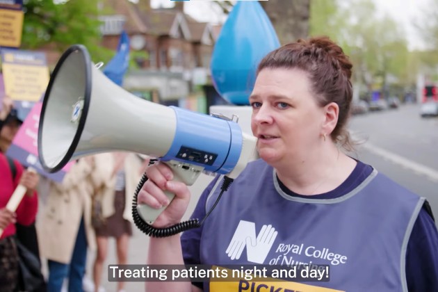 RCN member Laura Duffell speaks into a loudspeaker on nursing picket line in May 2023