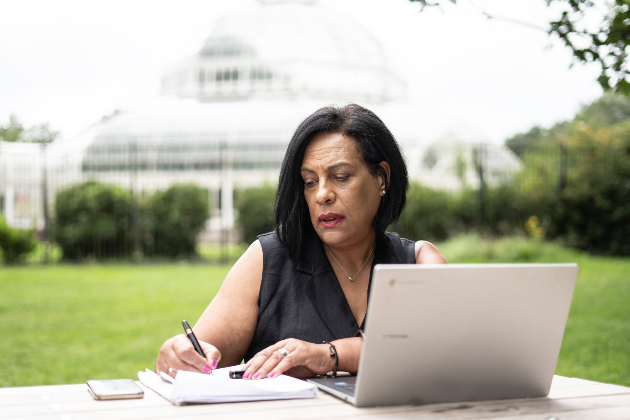 Michelle Cox sitting at desk