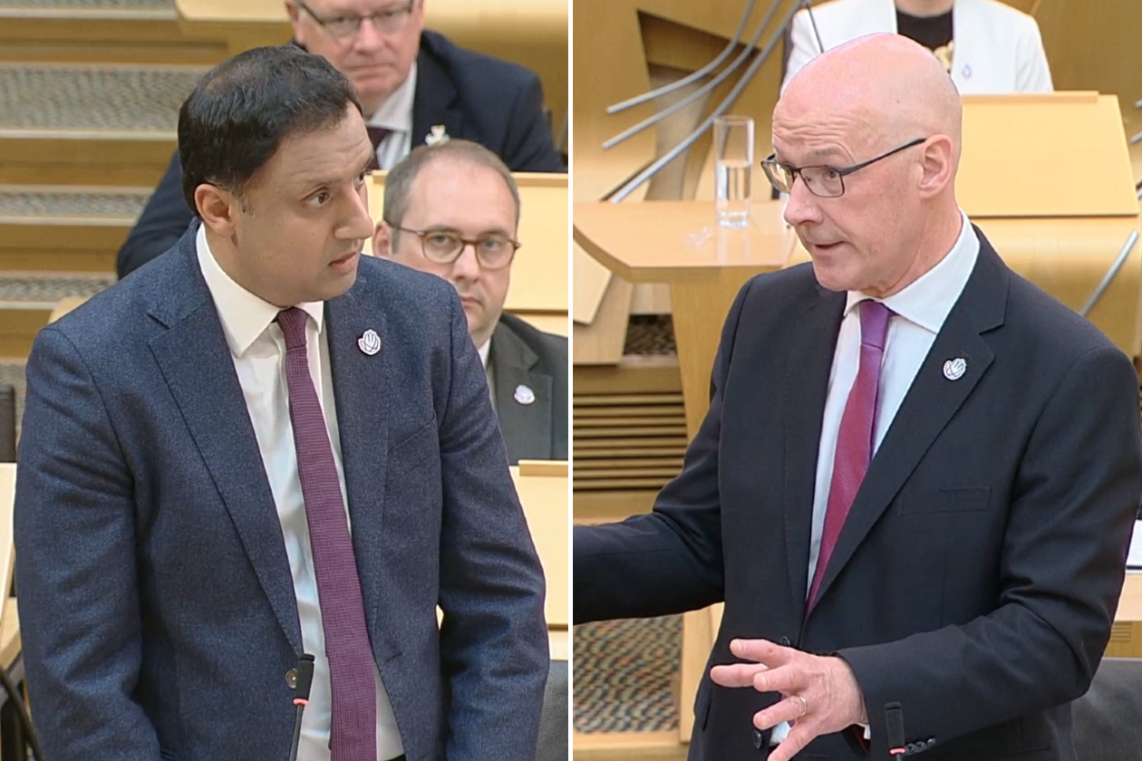 A composite image shows Scottish Labour leader Anas Sarwar on the left, and First Minister John Swinney on the right. Both images are taken from a session of the Scottish Parliament, with the tables and benches visible in the background. Both are wearing suits with dark red ties and looking serious as they debate.