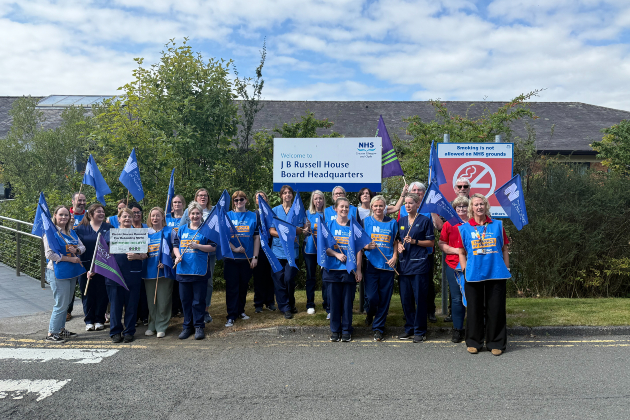 Group of district nurses with banners 