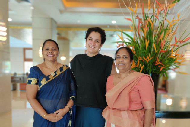 RCN staff member Elsa stood smiling with head PHNO nurses in Sri Lanka