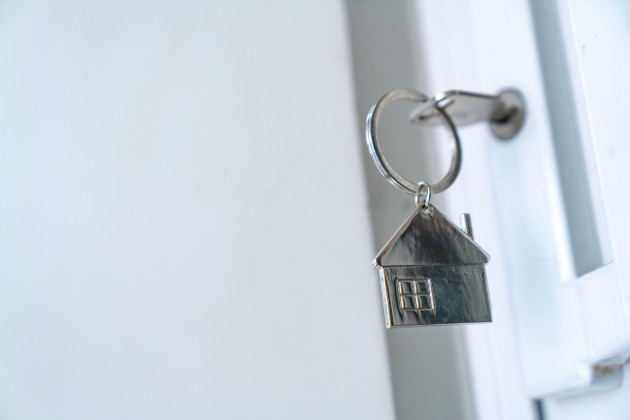Key in door with a house keyring