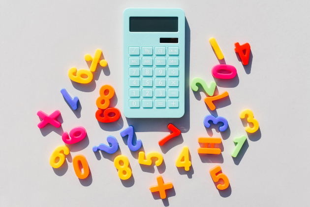 Calculator surrounded by brightly coloured numbers and mathematical symbols