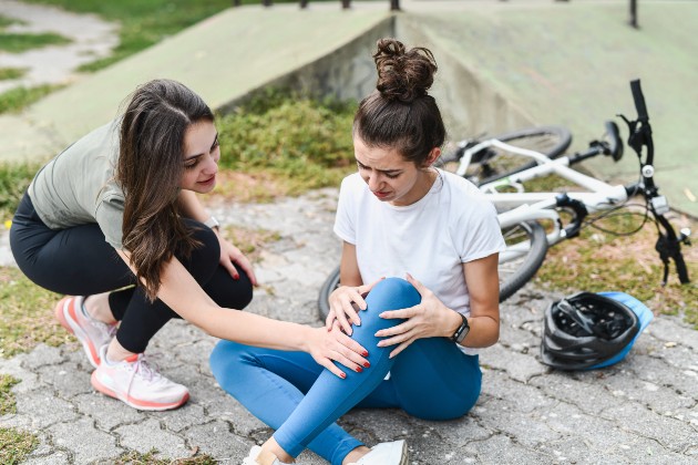 Person helping cyclist 
