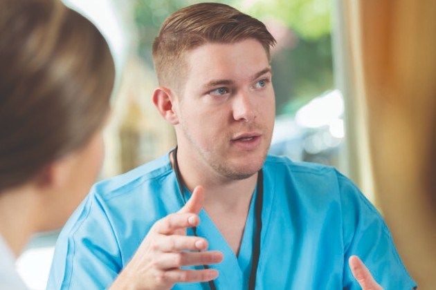 Male health care professional looking like he is concentrating