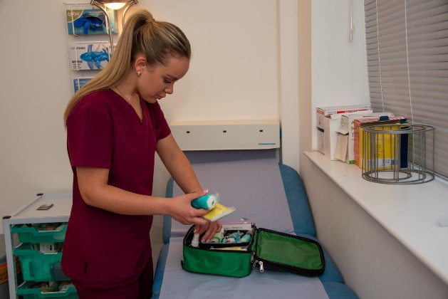 HCA Olivia checking a first aid kit