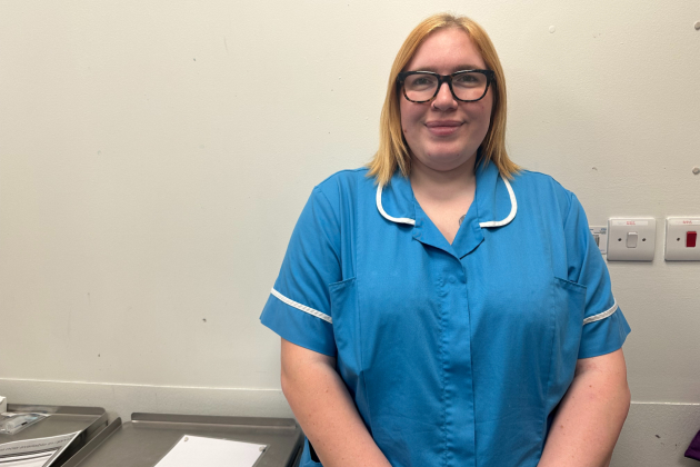 Nursing associate Hazel Taylor in uniform at her workplace