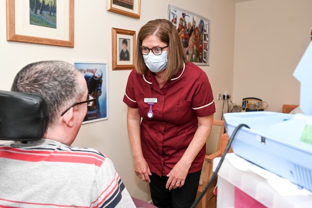 Nurse and care home manager Lesley McKillen, who was nominated for Northern Ireland Nurse of the Year 2022, administering tracheostomy care to her patient