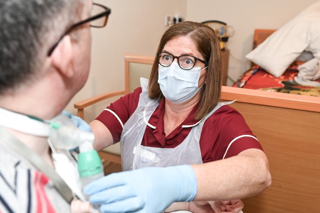 Nurse and care home manager Lesley McKillen, who was nominated for Northern Ireland Nurse of the Year 2022, administering tracheostomy care to her patient