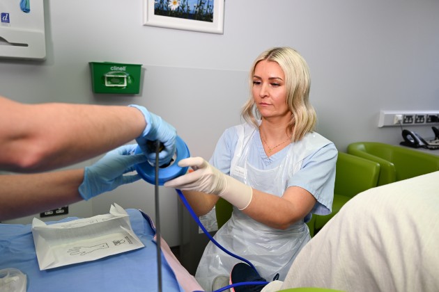 Nurse hysteroscopist Vicky Burns in Causeway Hospital Northern Ireland with nursing colleague carrying out a hysteroscopy