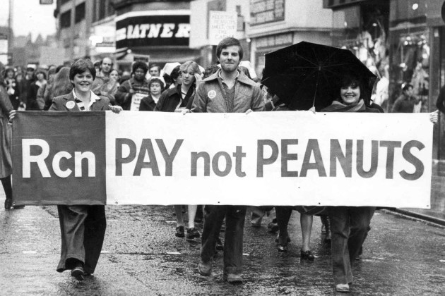 Nurses hold banner reading 'Pay not peanuts' as part of a 1969 campaign that led to a significant pay rise for nurses in the NHS