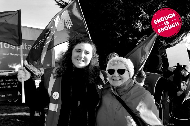 Lyndsay and member on the picket line in NI. Black and white image with 'enough is enough' stamp in red