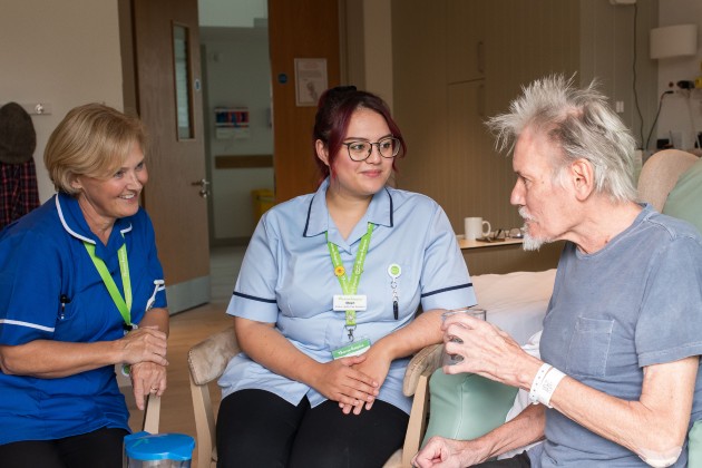 Steph and colleague talking to patient at St Thames Hospice