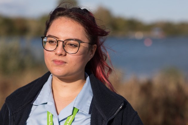 HCA Steph outside in the sunshine in uniform, pensive look on face