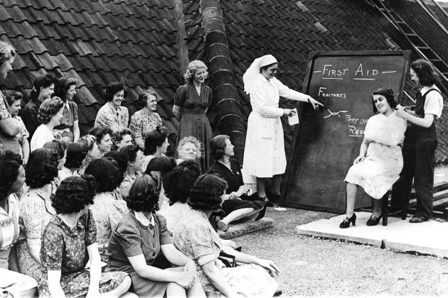 Industrial nurses teaching first aid to factory workers 1940-45
