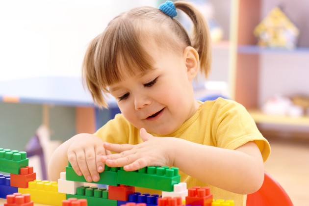Girl playing with lego