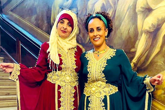 Afrah and Ofrah, founders of the British Arab Nursing and Midwifery Association, wearing traditional outfits in RCN HQ for the Kings NHS 75th celebration