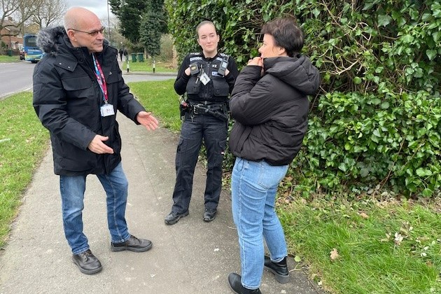 Ian Fairburn with colleagues having conversation outside
