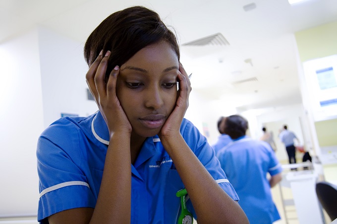 Nurse looks sad