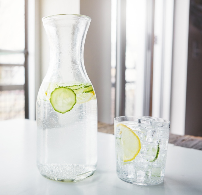 Water jug and glass on a table