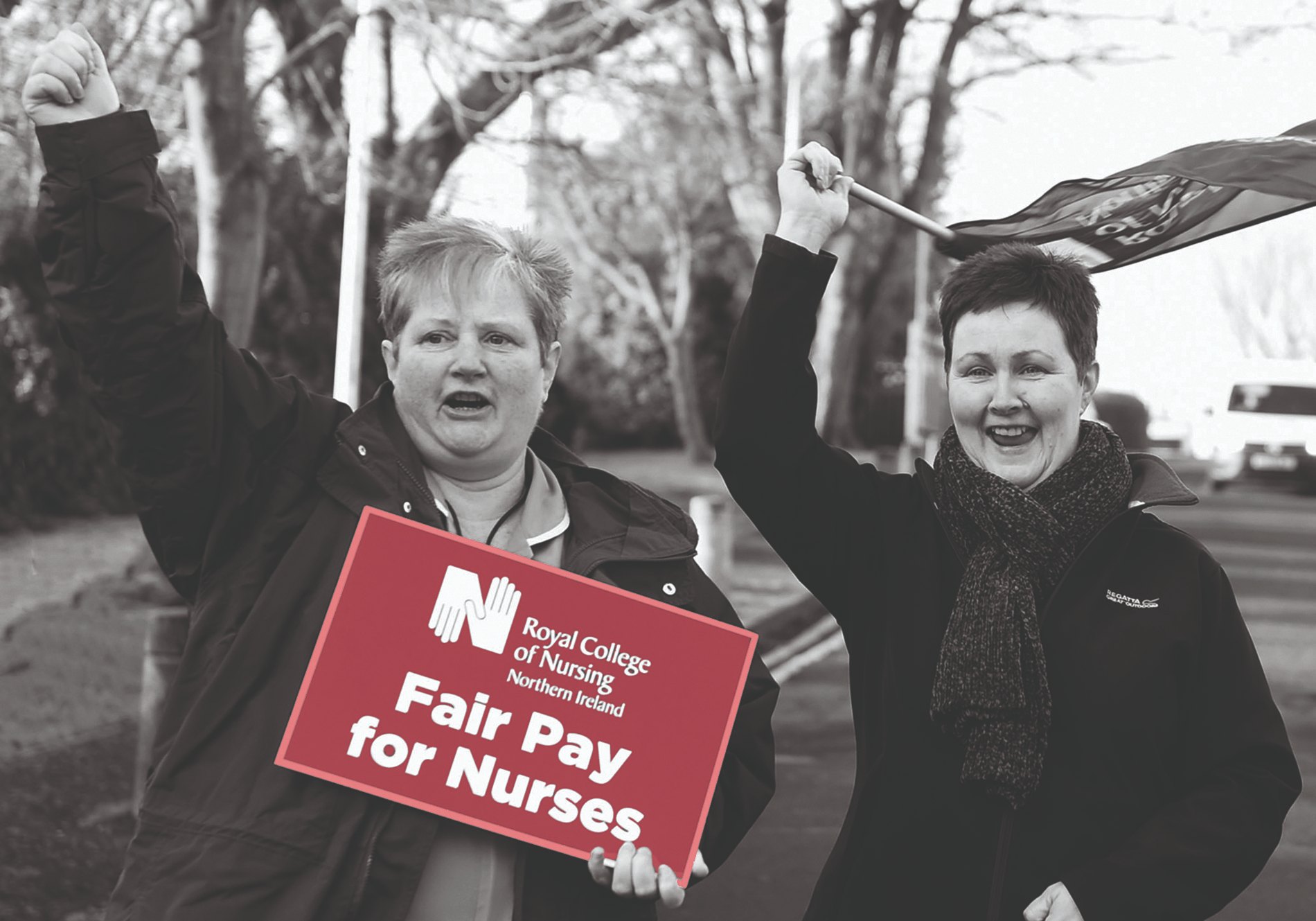 Two members in Northern Ireland hold a fair pay for nursing placard