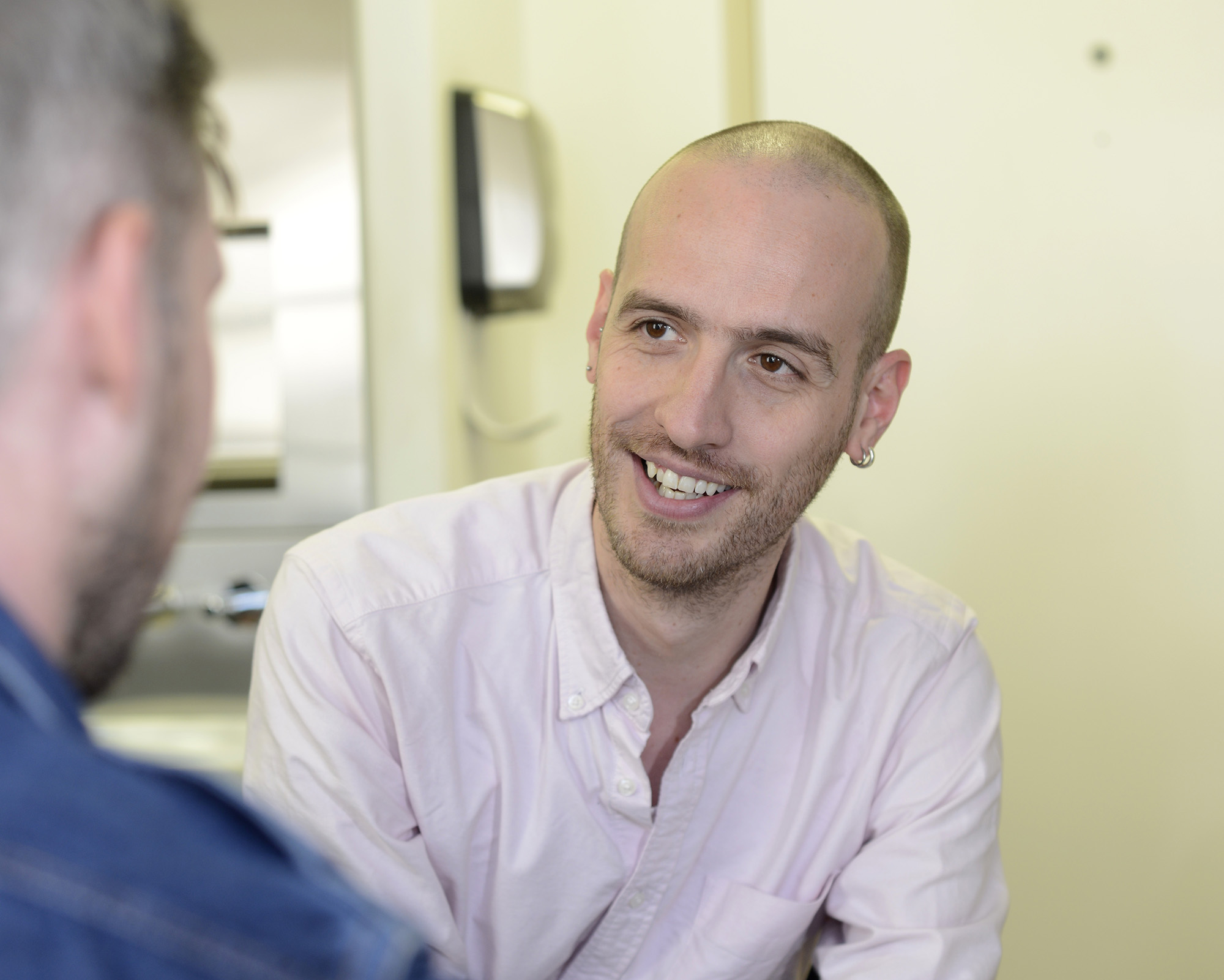 Nurse practitioner Joe Phillips gives advice to a patient 