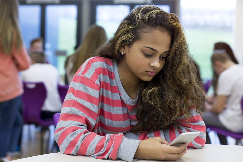 girl looking at phone