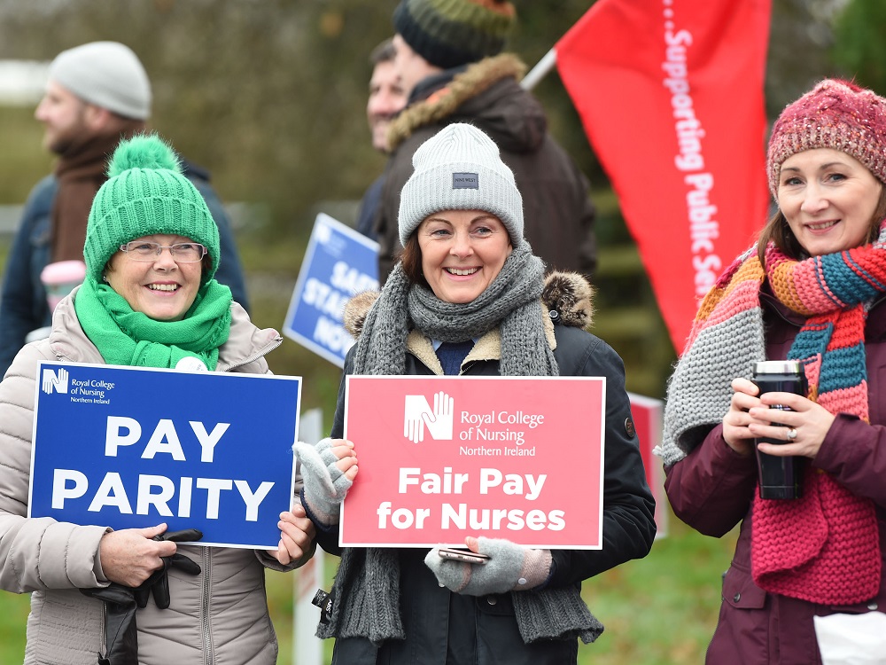 three women on picket line