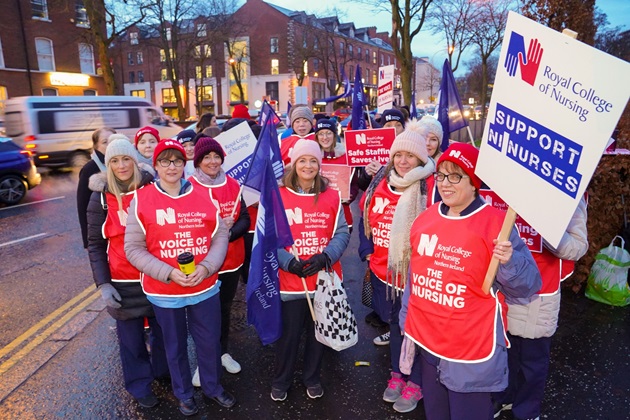 group of striking nurses with placards