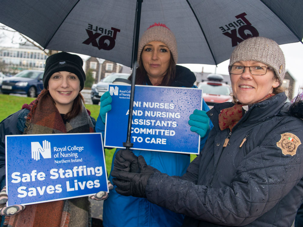 three women on the picket line