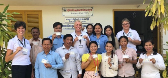 Sally Young and other UK volunteers pose with staff outside Battambang Hospital in Cambodia