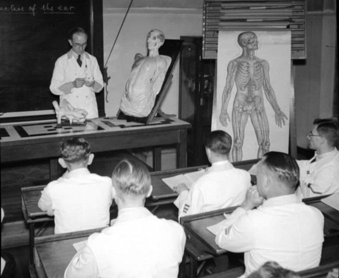 male trainee nurses attend a lecture about the ear at Hackney Hospital in 1943, from the Imperial War Museum archive