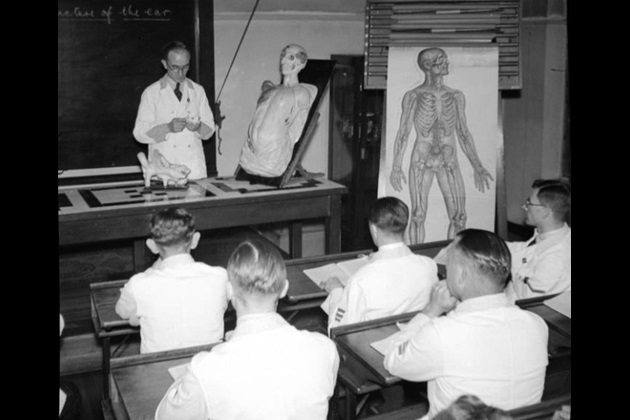 male trainee nurses attend a lecture about the ear at Hackney Hospital in 1943, from the Imperial War Museum archive