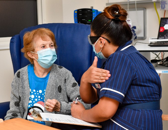 Matron May Parsons administers the first COVID-19 vaccine to patient Margaret Keenan