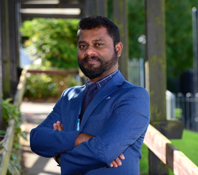 Sunny outdoors portrait of Suresh Packiam, co-founder of the British Indian Nurses Association 