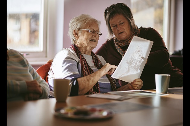 Two women take part in cultural outreach session for elderly with Northumbria University and TWAM (Tyne and Wear Archives and Museums) at Segedunum, Wallsend
