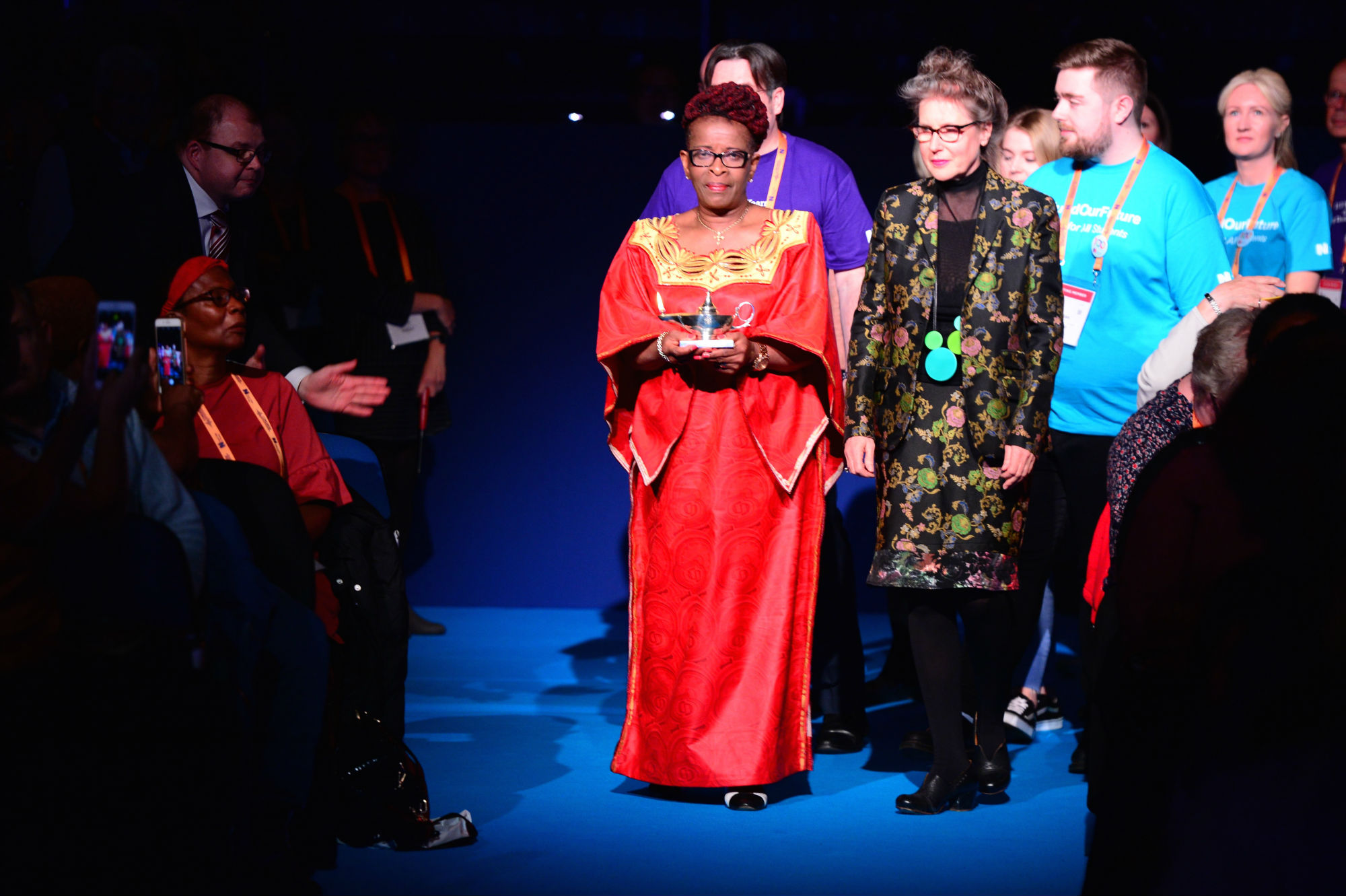 Former RCN President Cecilia Akrisie Anim and RCN President Anne Marie Rafferty lead the RCN lamp procession