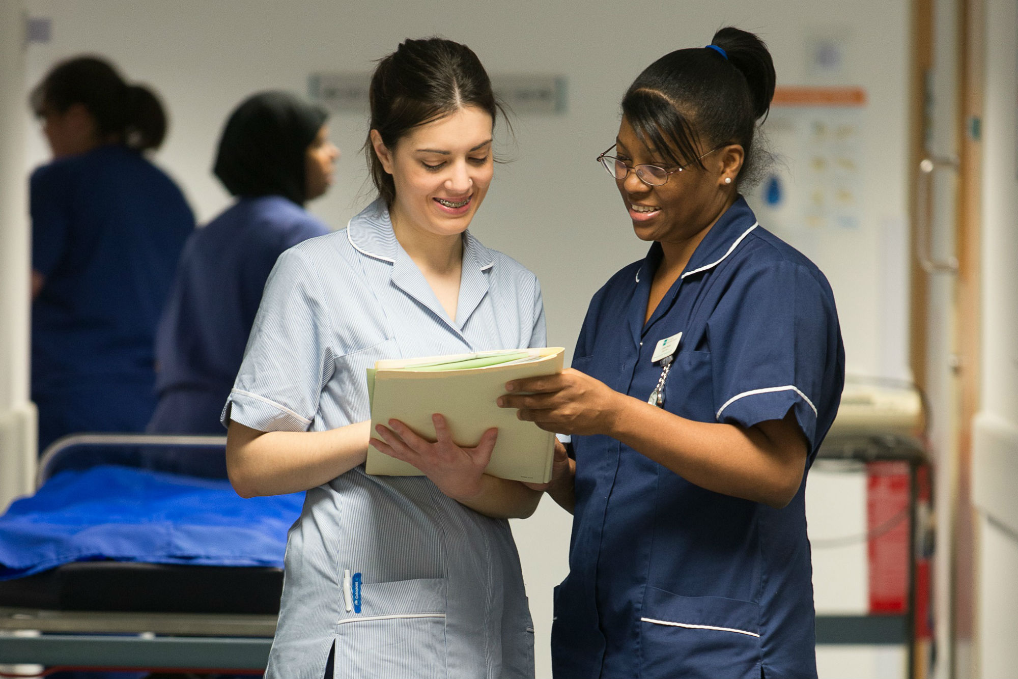 Nurses talking in corridor