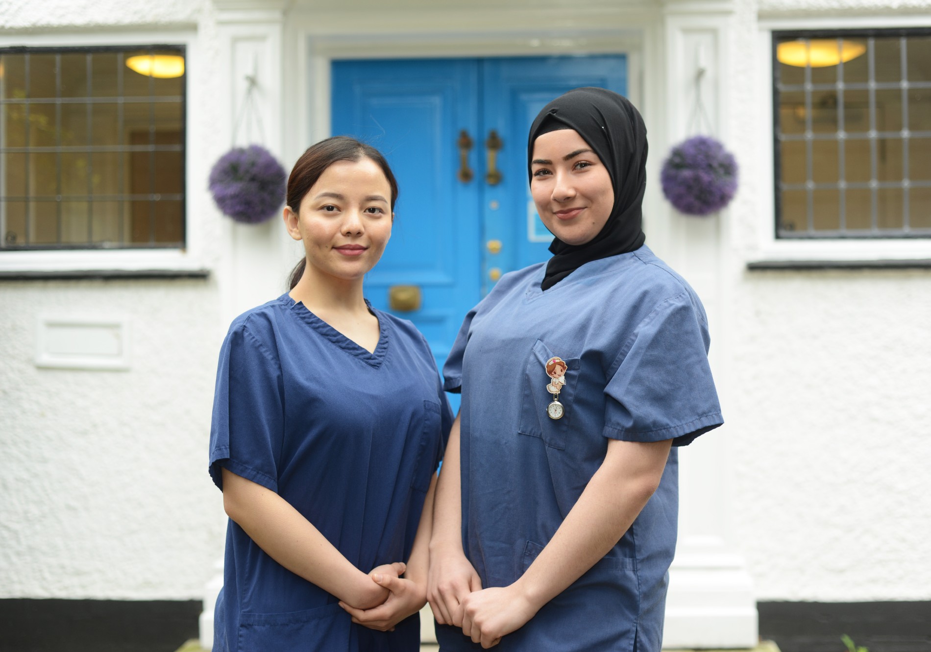 Nursing students Trishnu and Ozlem stand outside the Marie Stopes clinic in West London, where they completed a placement