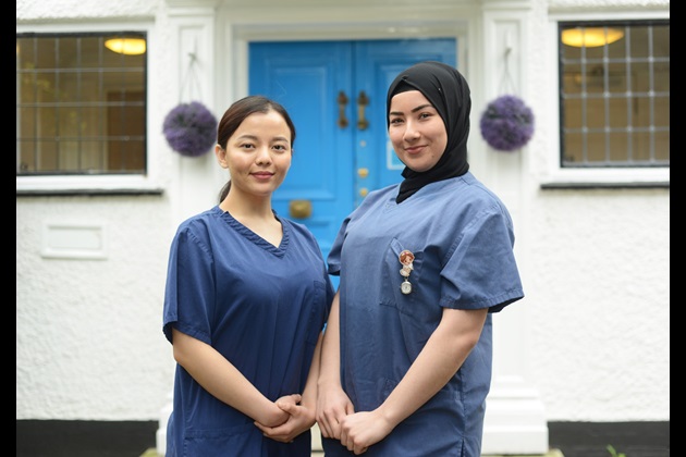 Nursing students Trishnu and Ozlem stand outside the Marie Stopes clinic in West London, where they completed a placement