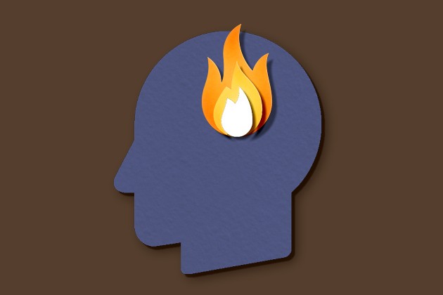 Illustration made from paper show silhouette of a head, with a fire burning inside the brain