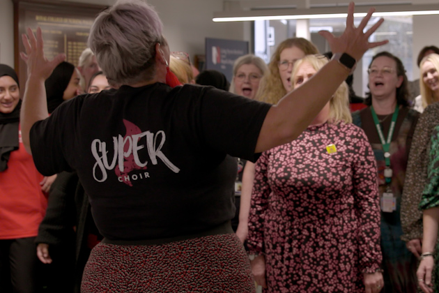 Nursing staff being led in singing by Superchoir Cardiff
